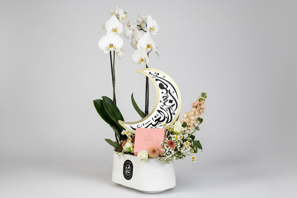 Professional floral arrangement with white orchids