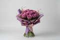 Purple rose wrapped bouquet